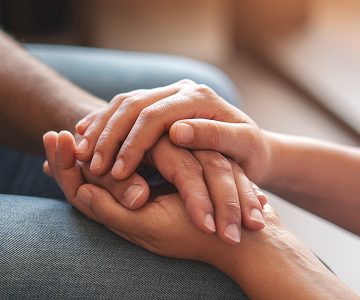 Close-up of hands expressing care